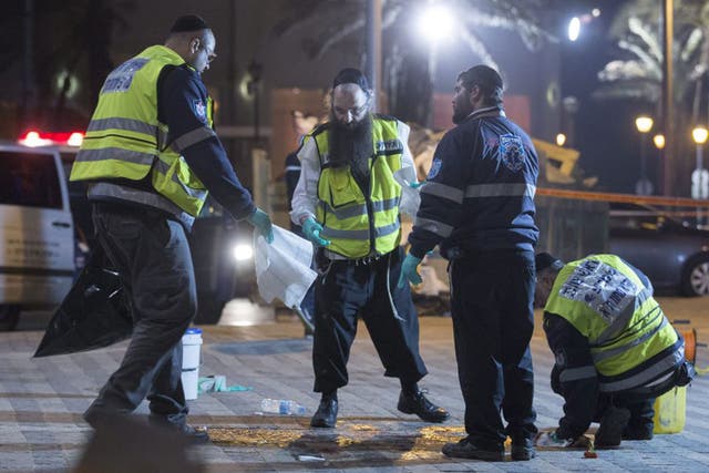 The clean-up operation gets underway at the scene of the stabbing attack in old Jaffa, just south of Tel Aviv, Israel