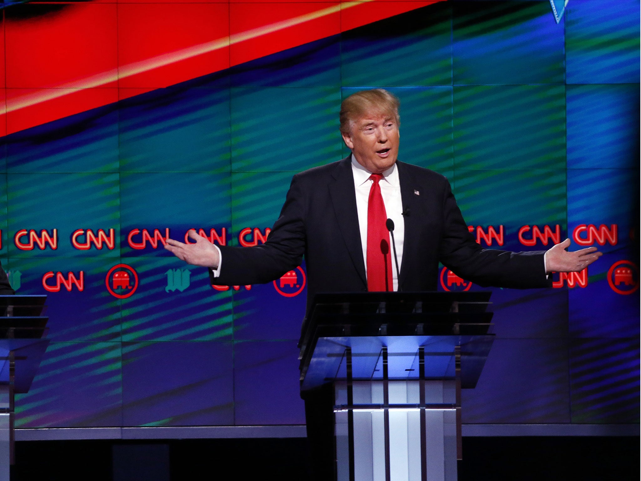 Republican presidential candidate Donald Trump speaks at Republican presidential debate at the University of Miami
