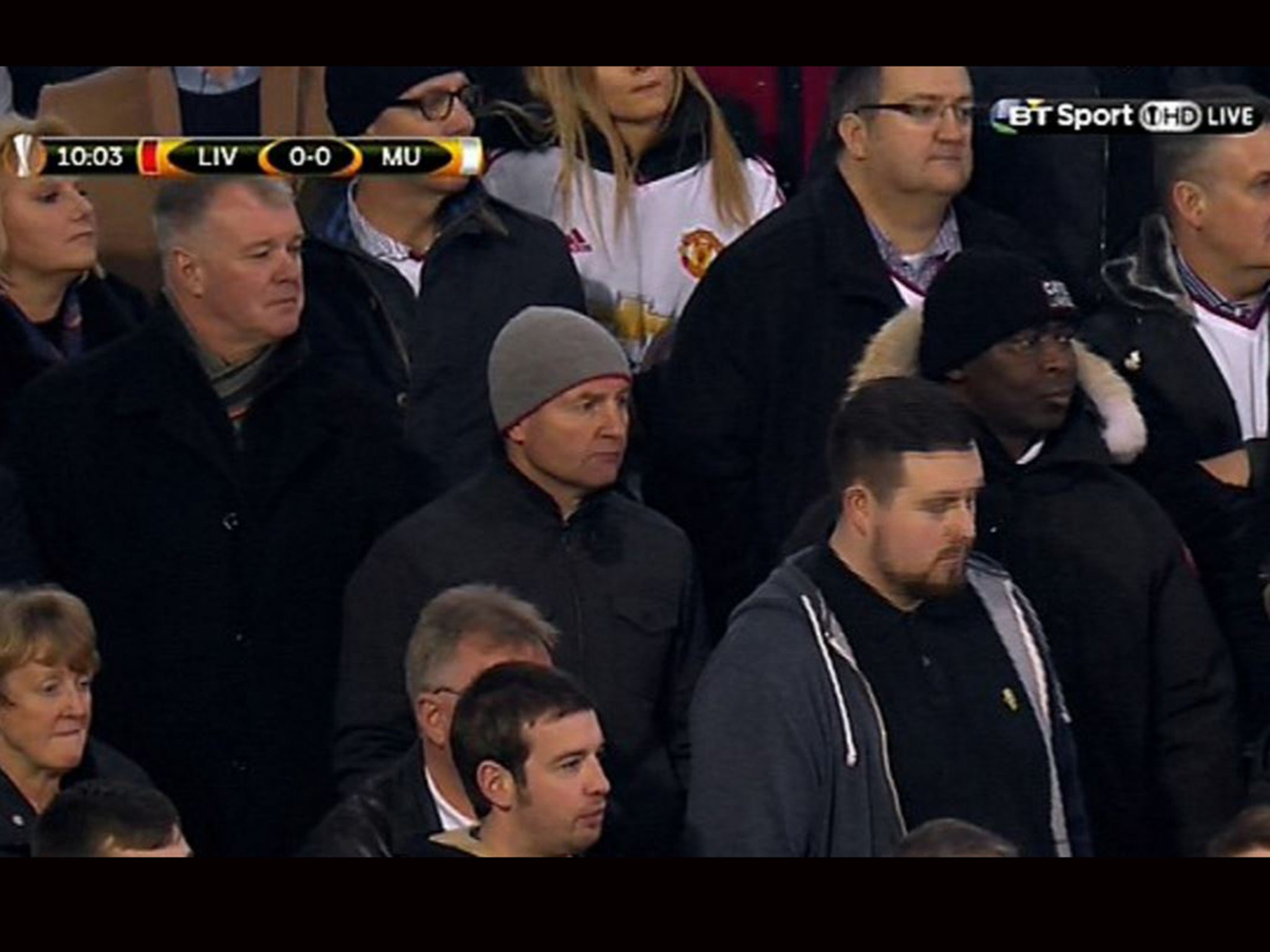 Gary Pallister, Dennis Irwin and Andy Cole sitting with Manchester United fans