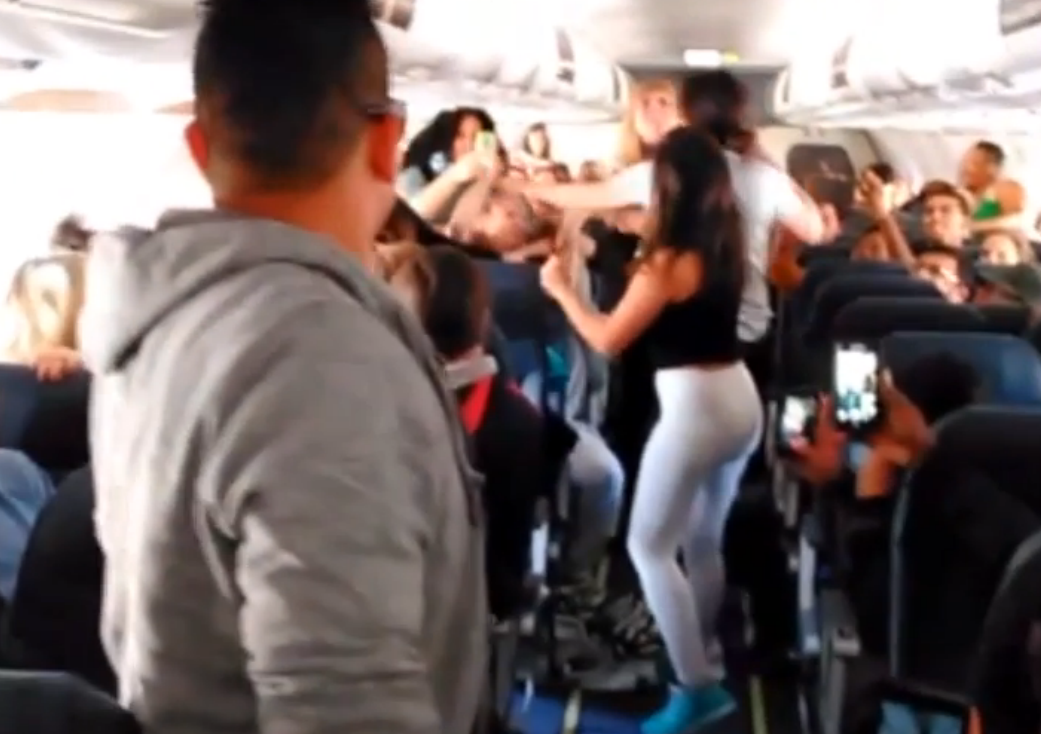 Women fight on plane in mid-flight brawl over loud music caught on ...