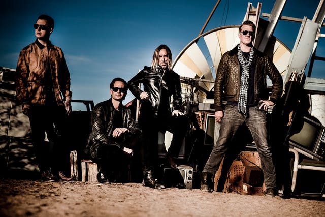 Iggy and his current band members, including Josh Homme