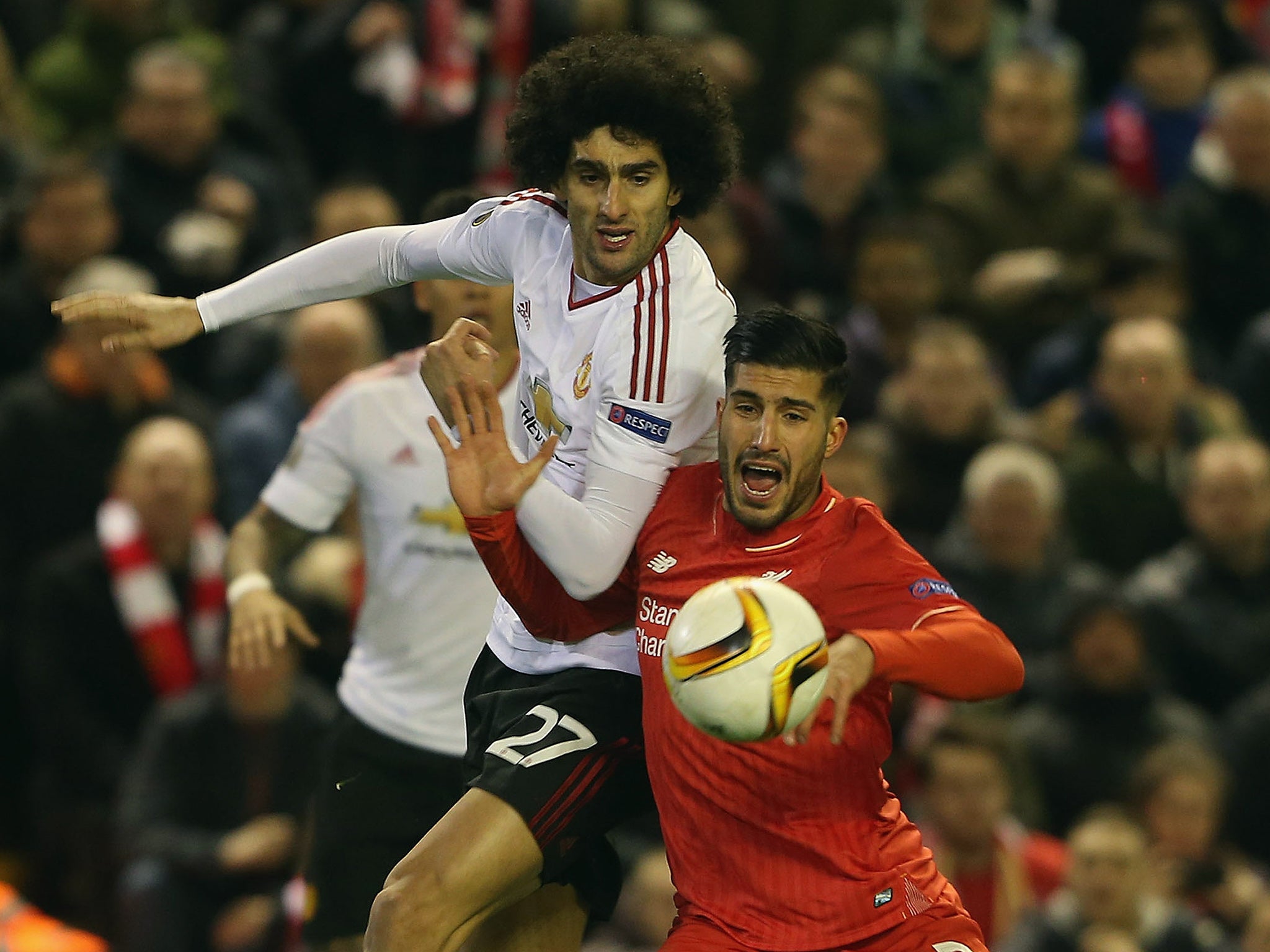 Marouane Fellaini and Emre Can compete for the ball