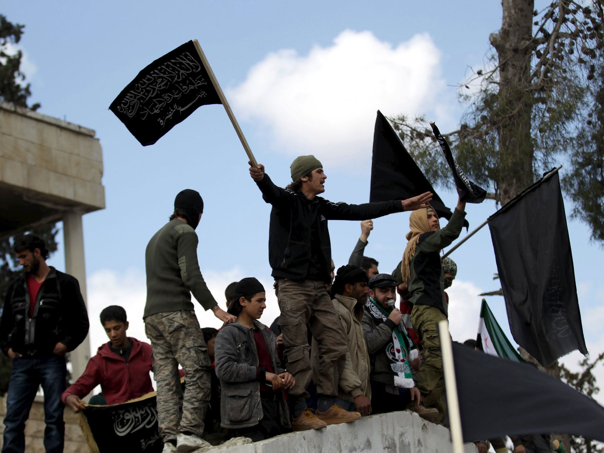 Jabhat al-Nusra supporters drowning out pro-democracy protesters