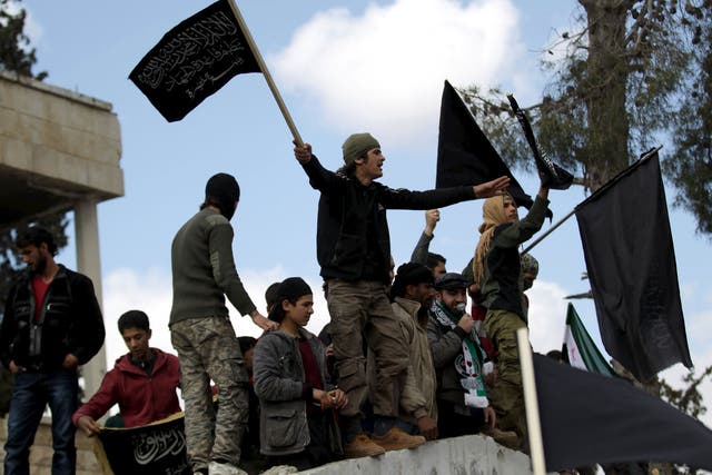 Jabhat al-Nusra supporters drowning out pro-democracy protesters