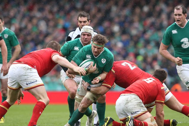 Jamie Heaslip of Ireland is tackled during the RBS Six Nations match between Ireland and Wales