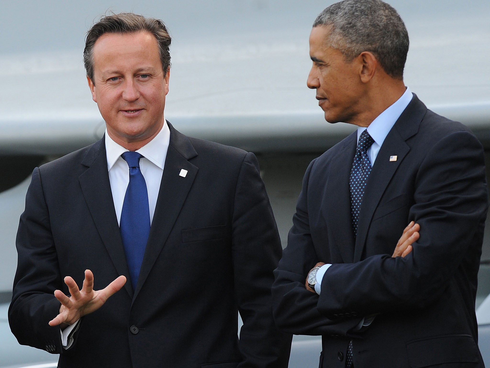 Barack Obama and David Cameron talking in 2014