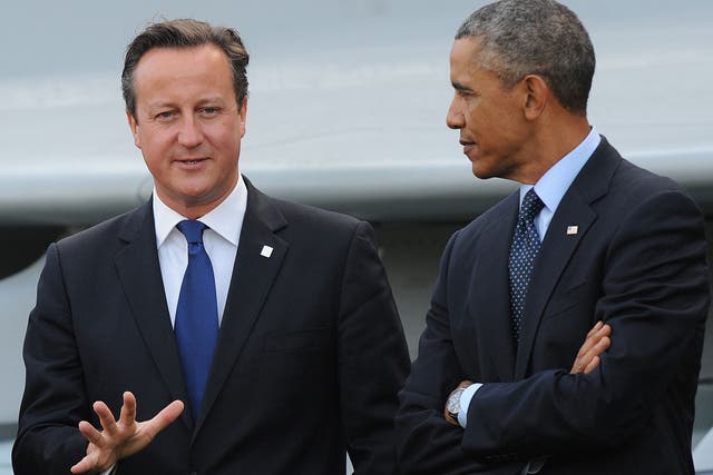 Barack Obama and David Cameron talking in 2014