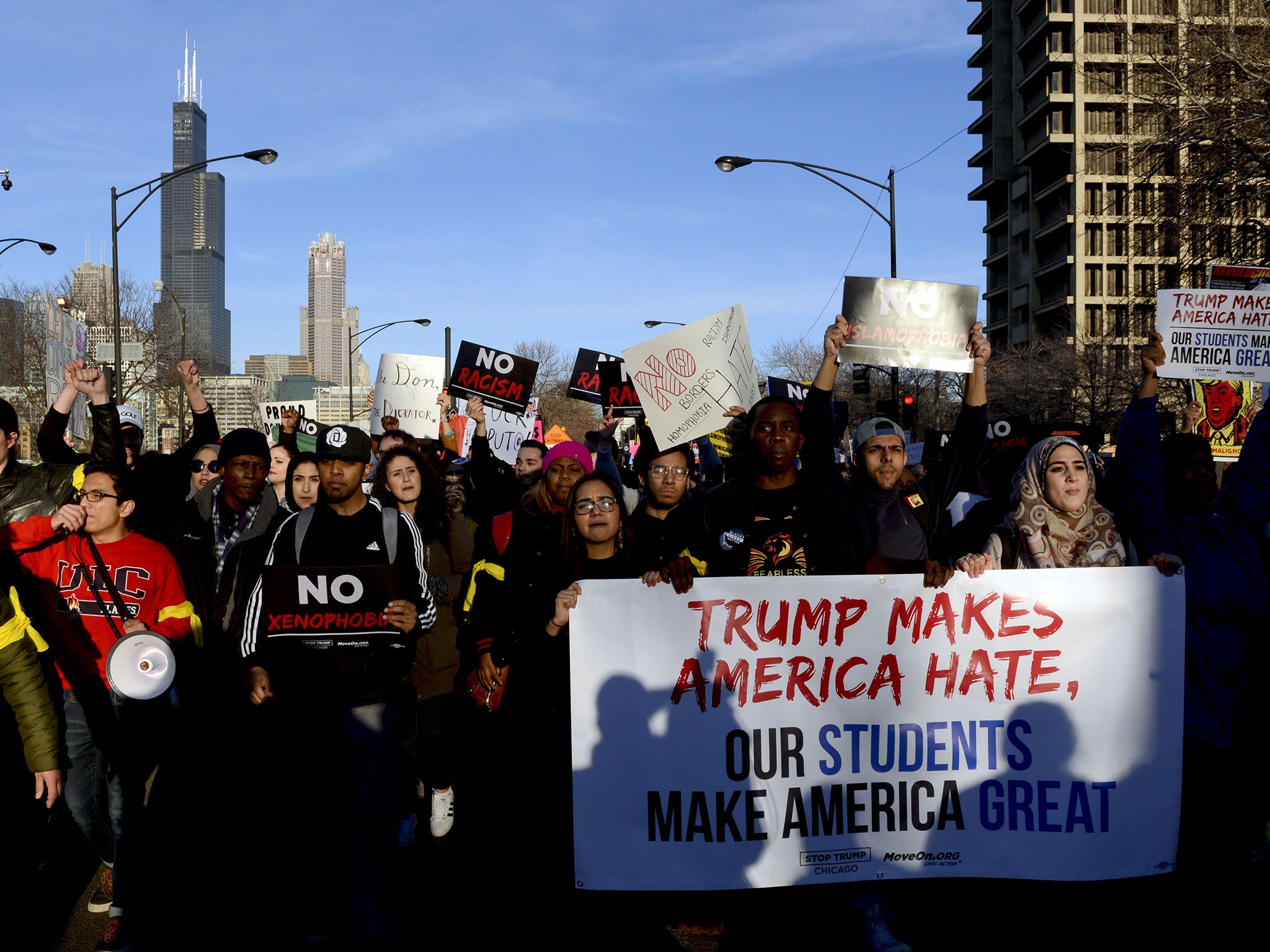 Protestors march in Chicago ahead of Mr Trump's planned event at the University of Illinois-Chicago