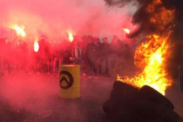 Generation Identitaire activists burned tyres and set off flares before the demonstration was dismantled by police on 12 March