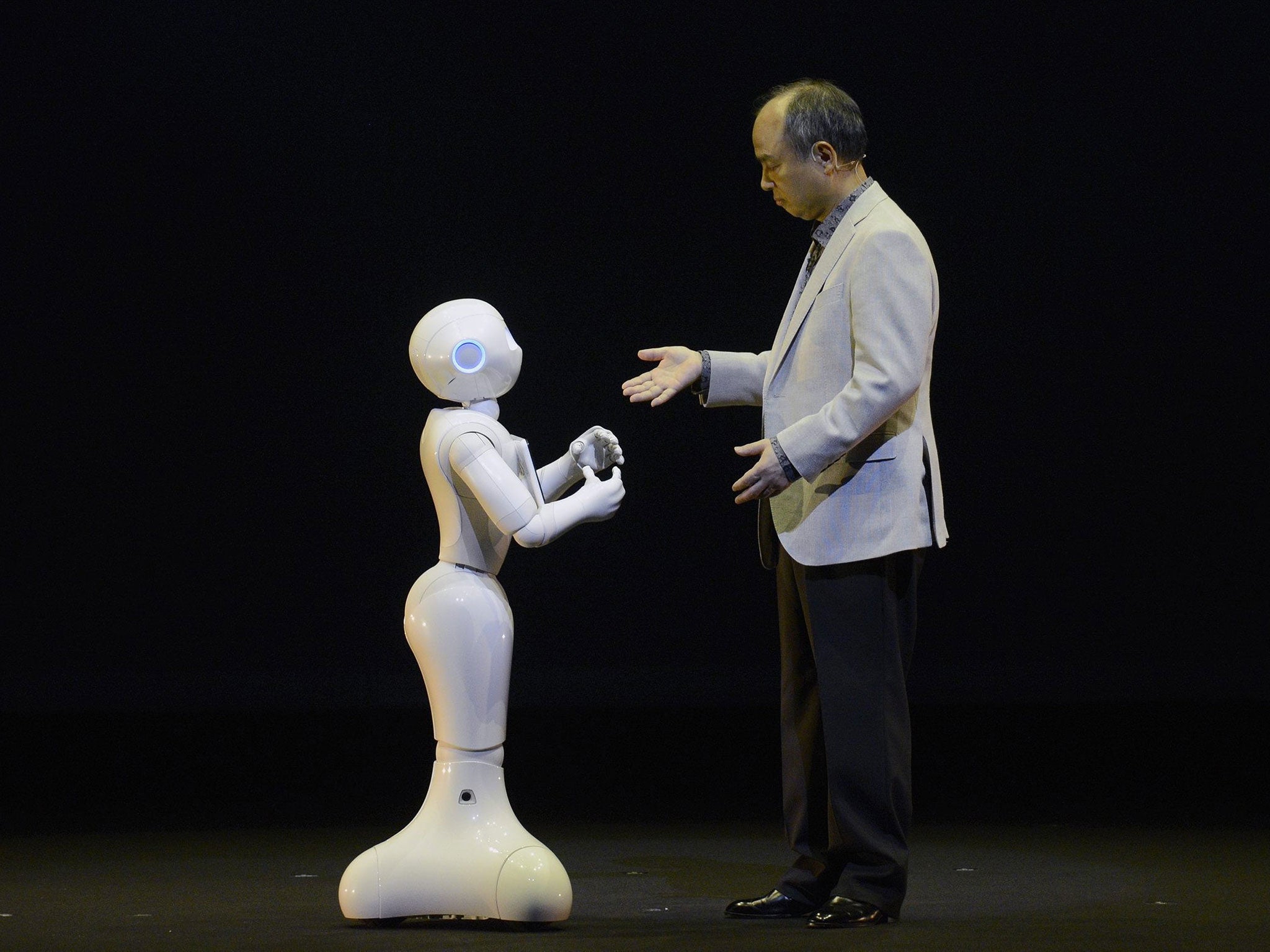 Electric dreams: SoftBank CEO Masayoshi Son interacts with humanoid robot ‘Pepper’ EPA