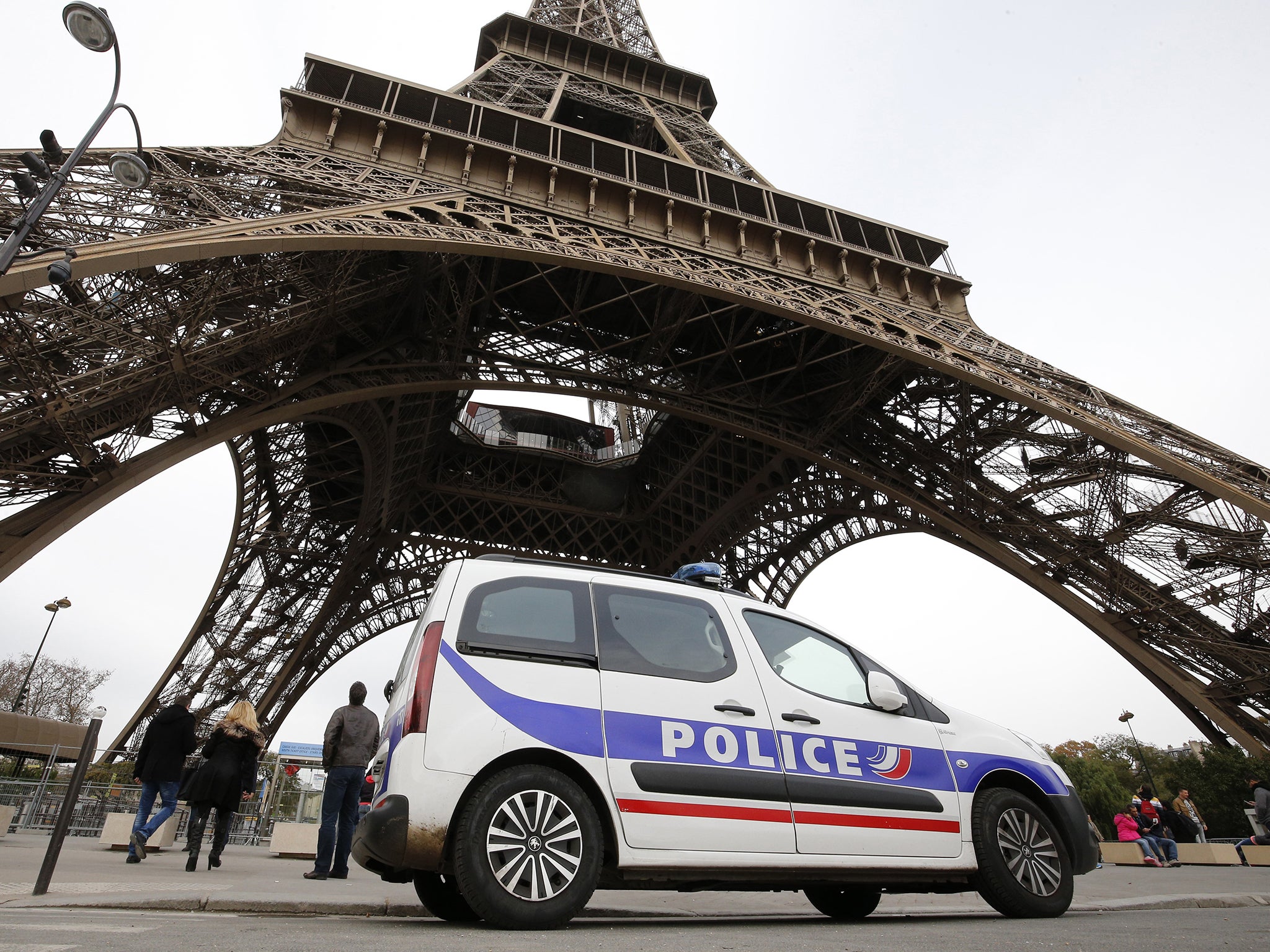 Police patrol at the Eiffel Tower following November terror attacks