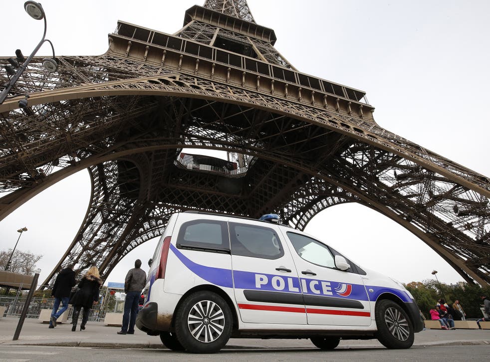 Police patrol at the Eiffel Tower following November terror attacks