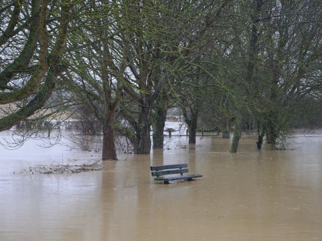 Evidence floods in: The river Glen burst its banks, submerging roads in Corby Glen, Lincs