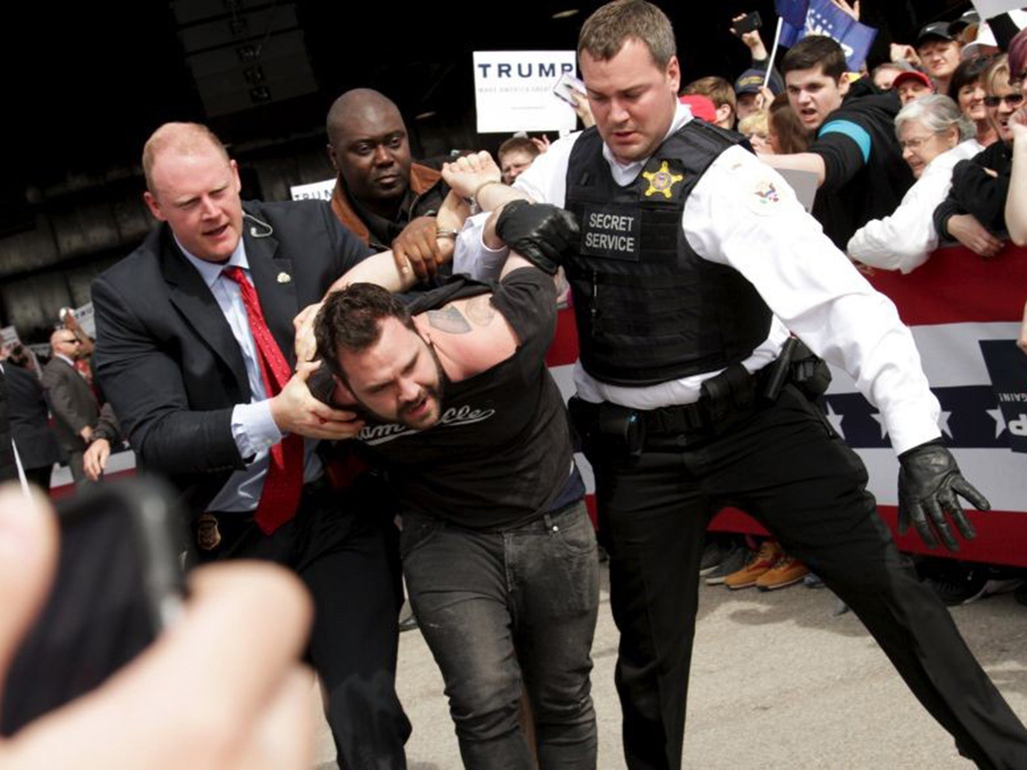 Secret Service detain a man during the Dayton rally in Ohio