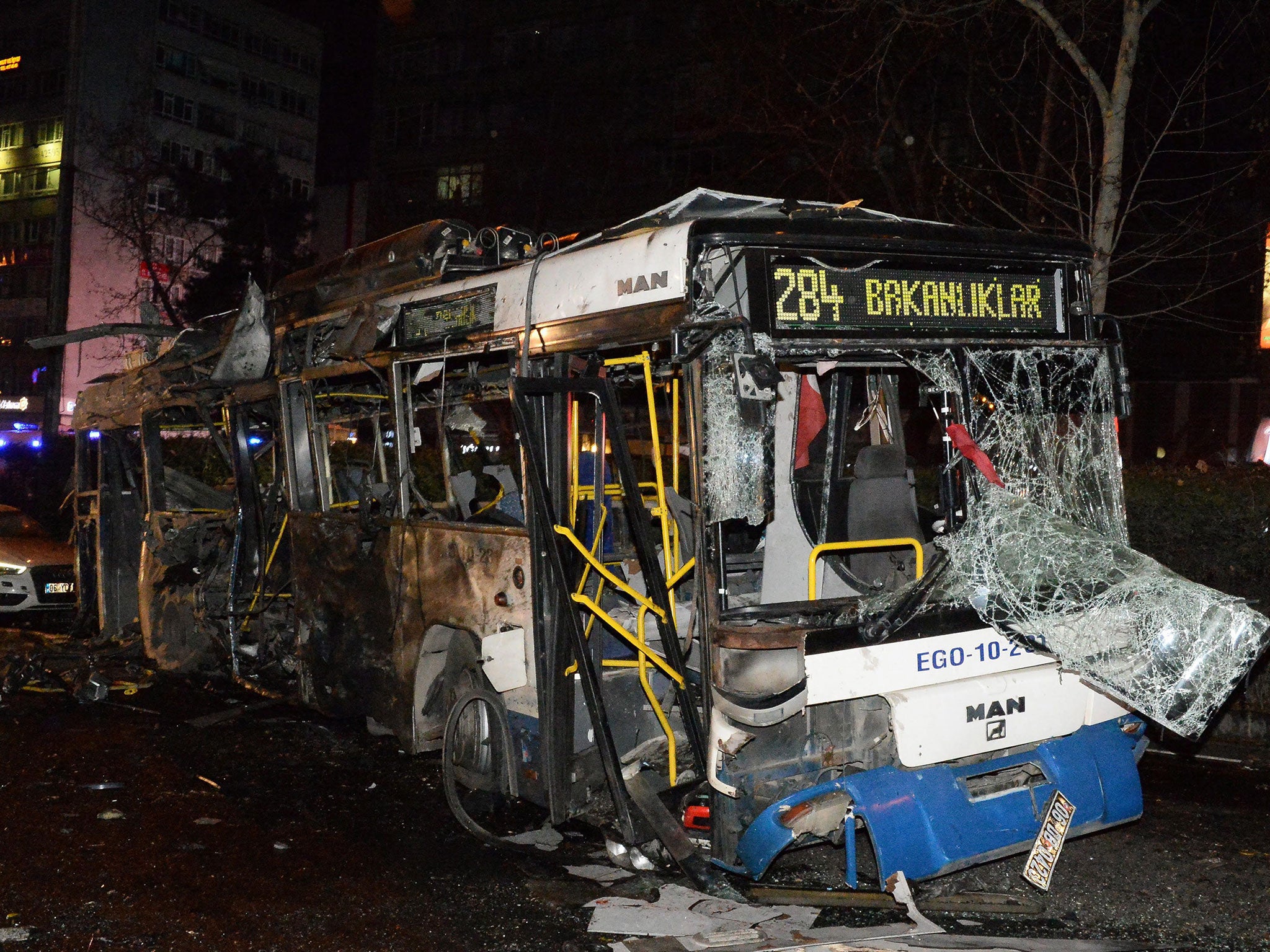 A destroyed bus is seen in the street after an explosion in Ankara. The exploison happened near a crowded bus station and many people were reported to have suffered injuries according to local media