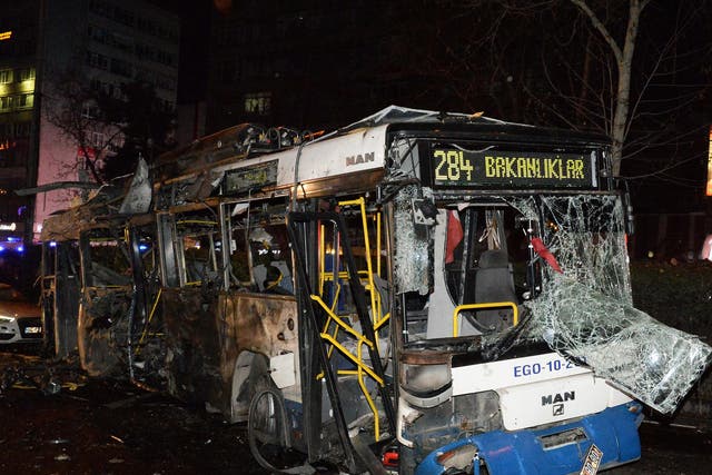 A destroyed bus is seen in the street after an explosion in Ankara. The exploison happened near a crowded bus station and killed at least 34 people and wounded 125