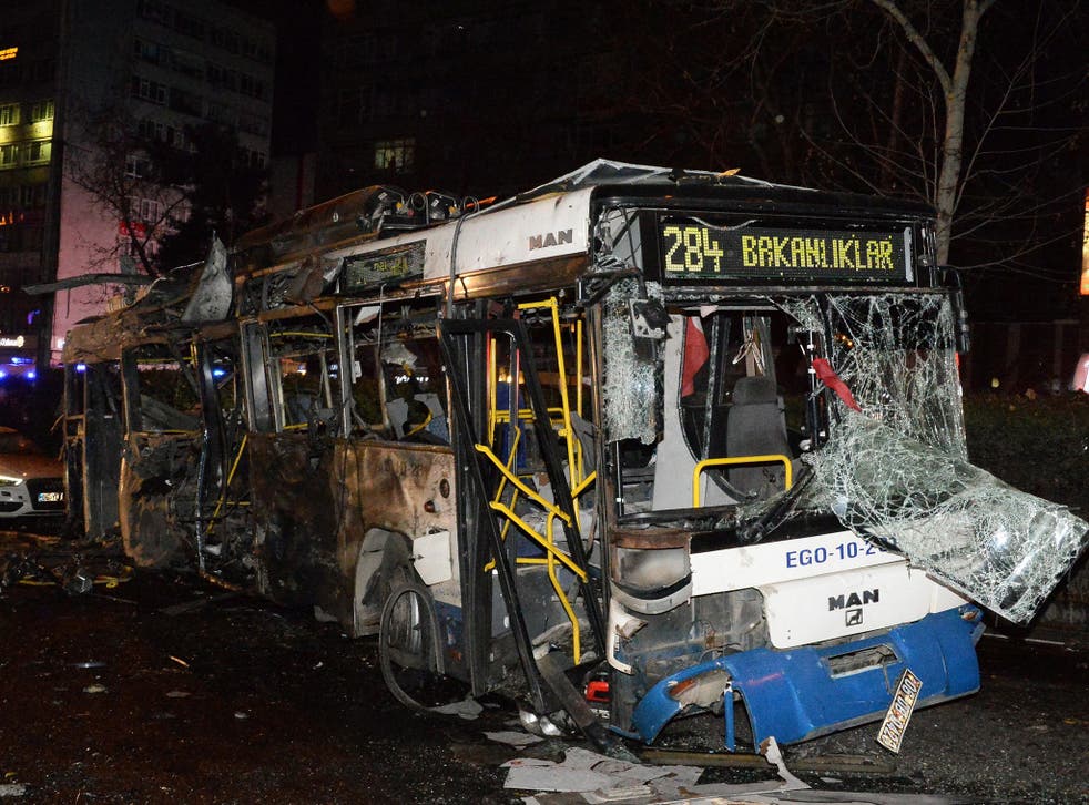 A destroyed bus is seen in the street after an explosion in Ankara. The exploison happened near a crowded bus station and killed at least 34 people and wounded 125