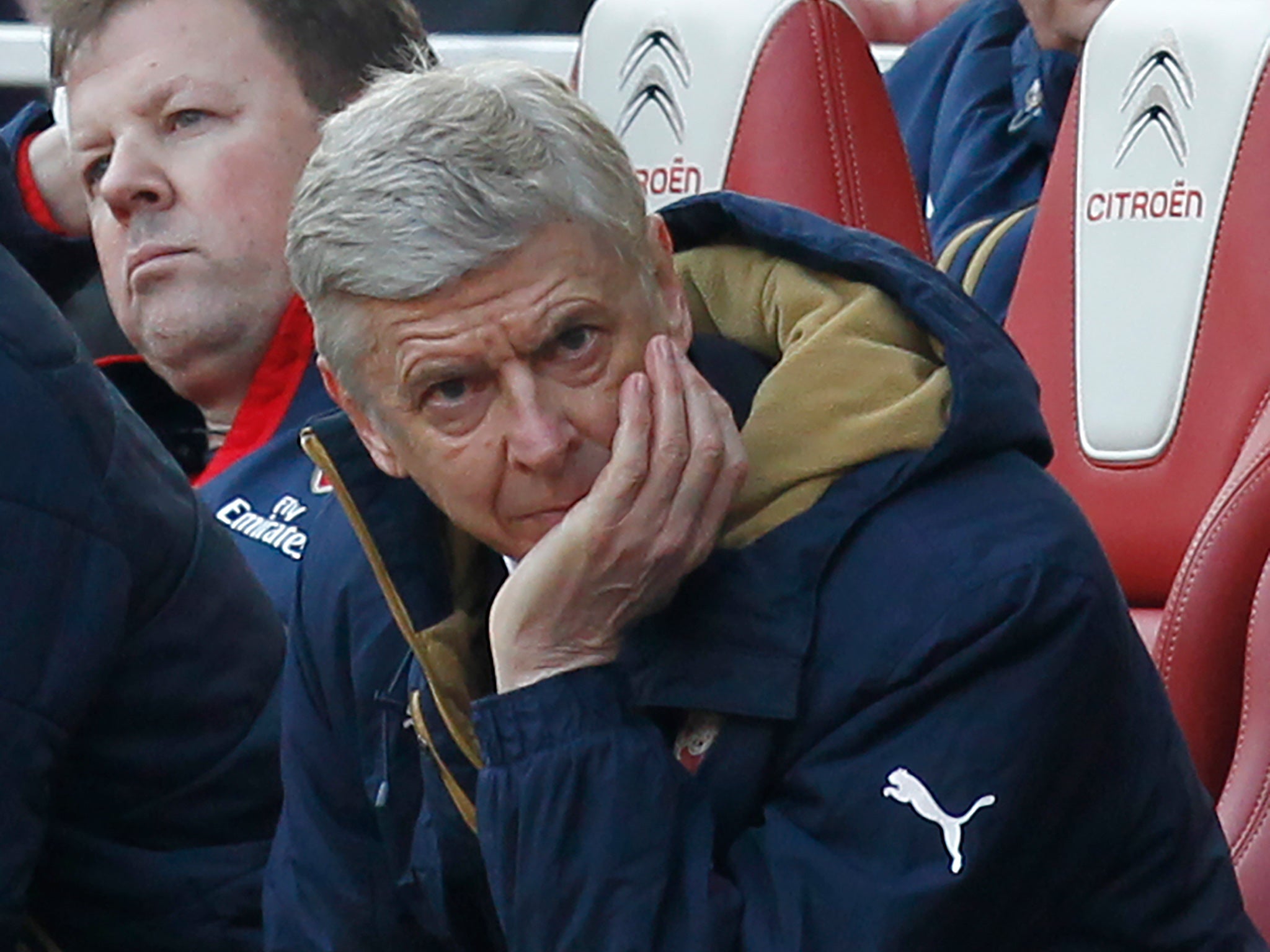 Arsene Wenger looks on from the dugout during Arsenal's defeat