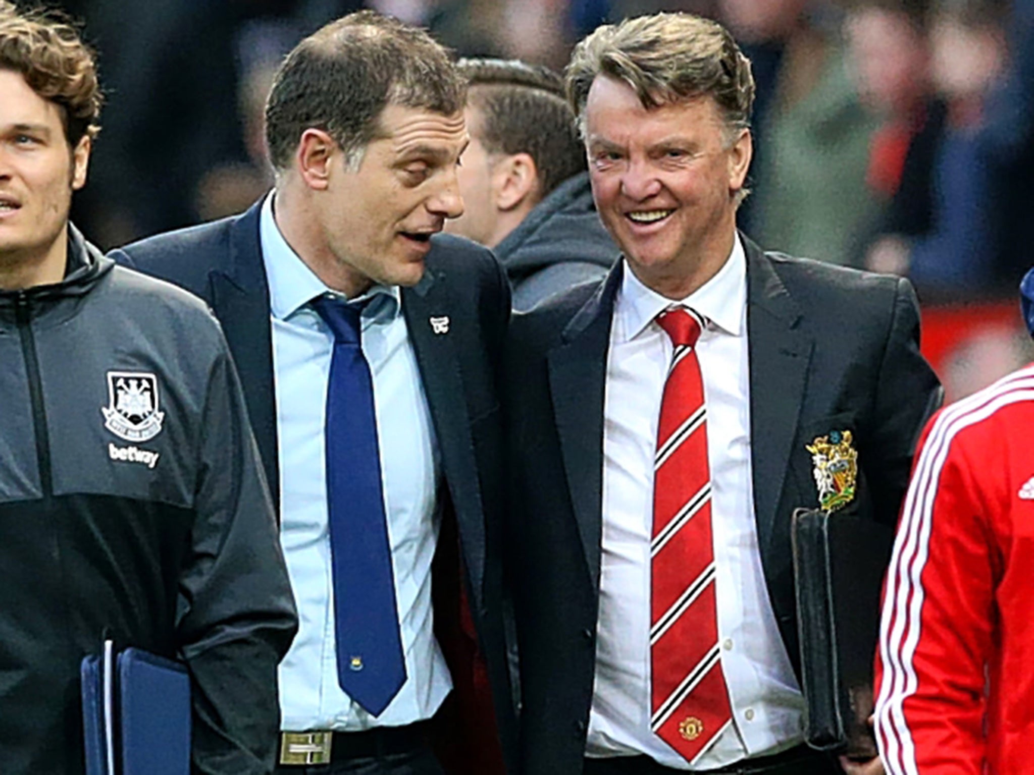 The Manchester United manager, Louis van Gaal (right), shares a joke with West Ham counterpart Slaven Bilic after the match