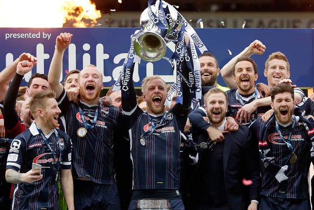 Ross County players celebrate with the Scottish League Cup
