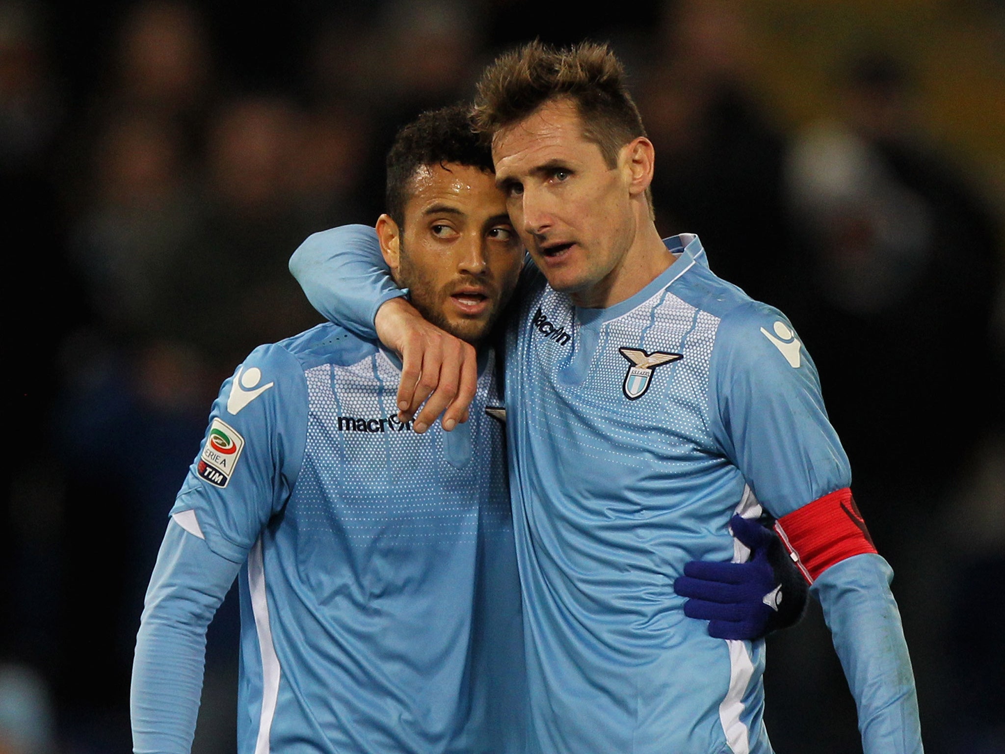Felipe Anderson and Miroslav Klose celebrate during Lazio's win over Atalanta