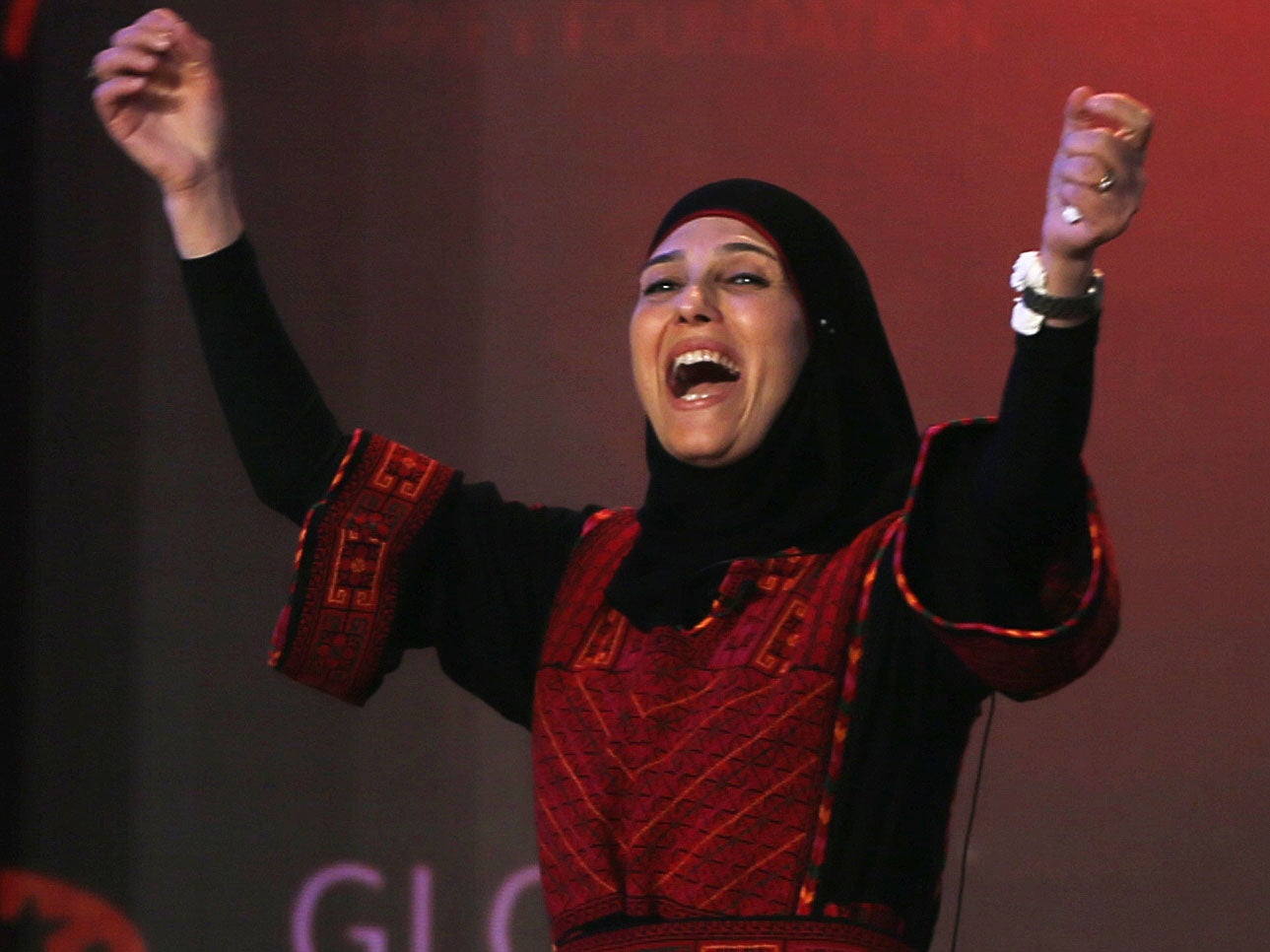 Palestinian primary school teacher Hanan al-Hroub reacts after she won the second annual Global Teacher Prize