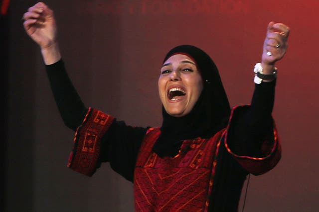 Palestinian primary school teacher Hanan al-Hroub reacts after she won the second annual Global Teacher Prize