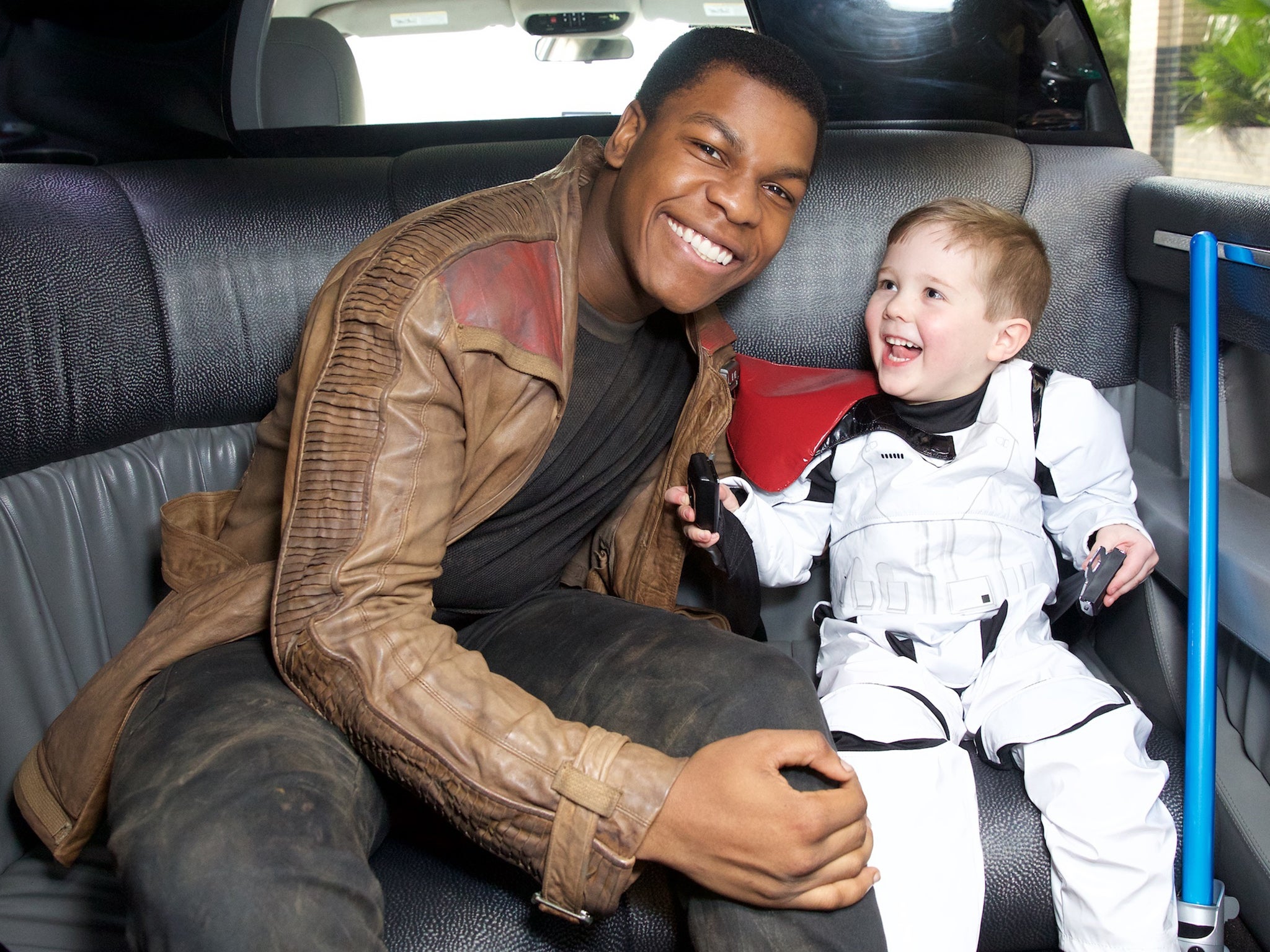 Star Wars actor John Boyega with Daniel Bell, 5, at The Royal London Hospital,