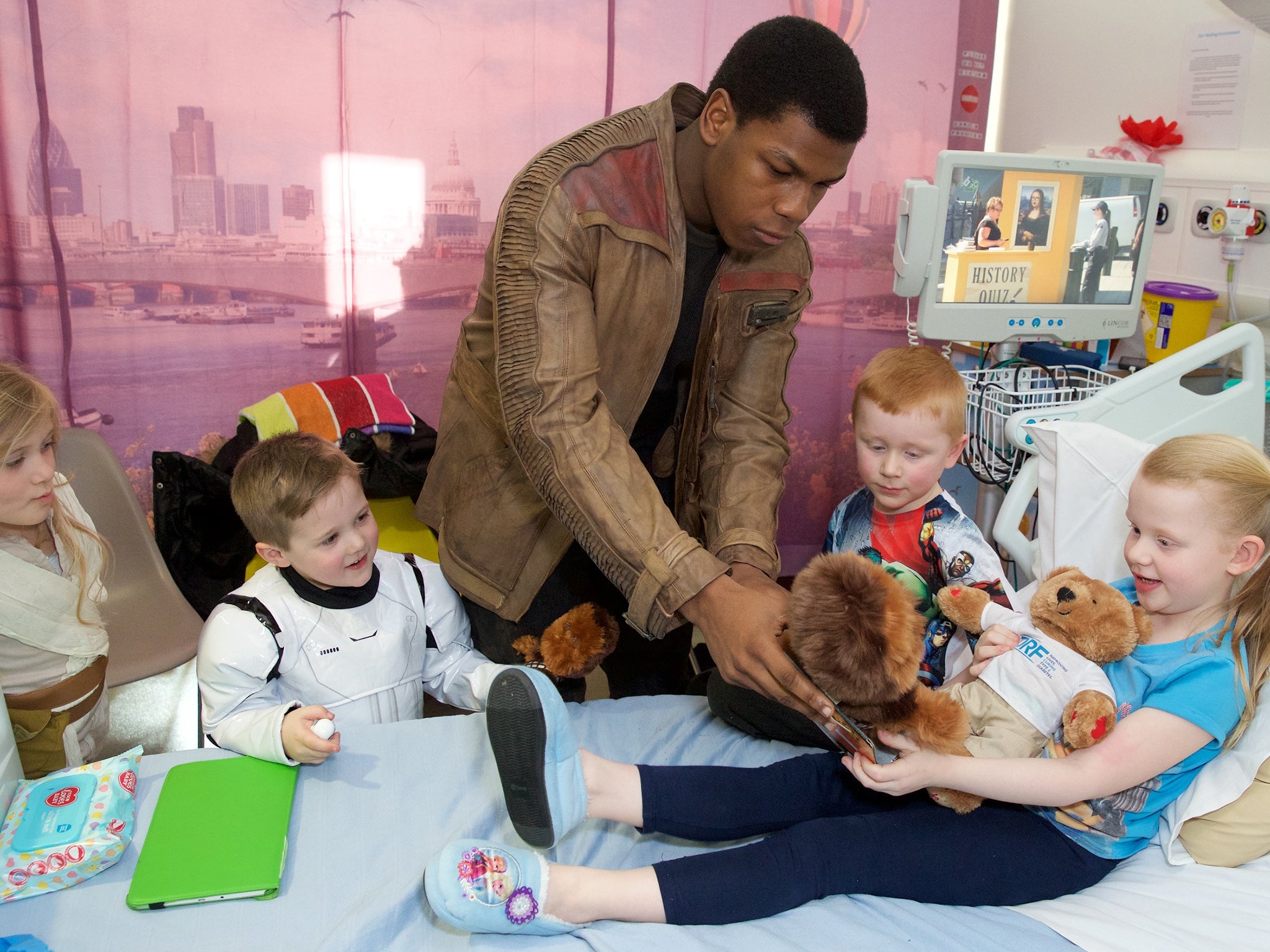 The pair handed gifts to other children in The Royal London Hospital