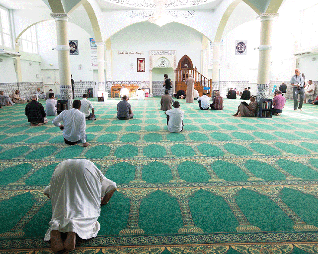 People pray at the Villefontaine mosque in France in 2015