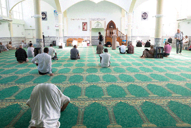 People pray at the Villefontaine mosque in France in 2015
