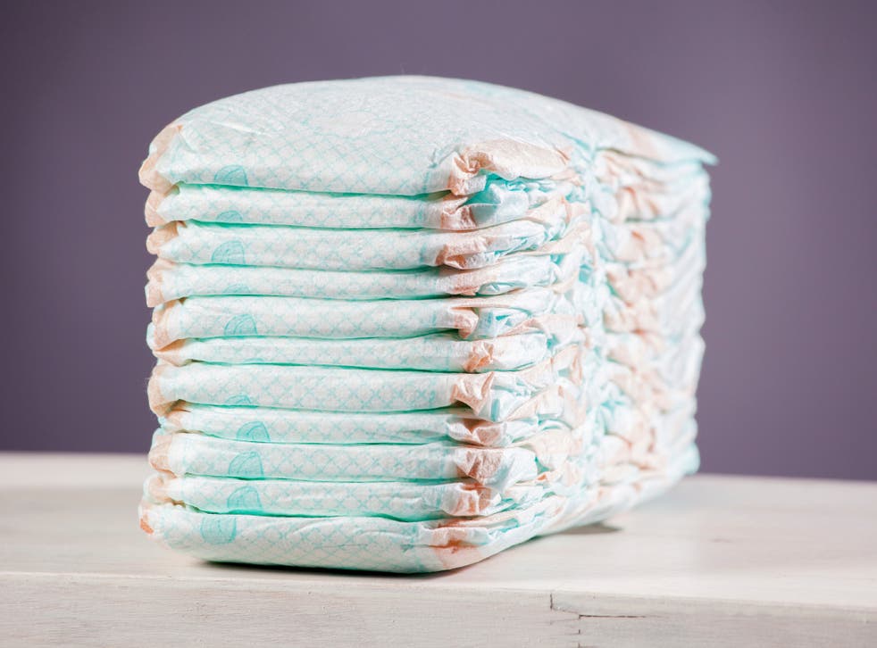 A police officer bought a woman nappies after she was accused of trying to shoplift them