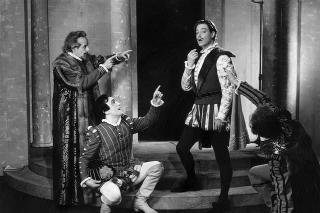English actor Robert Donat, second from right, as 'Benedick' in a production at the Aldwych Theatre, London in 1946