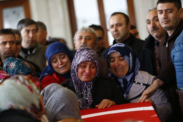 Relatives of Murat Gul, one of the victims of Sunday’s bomb near a bus station in Ankara, mourn at his funeral