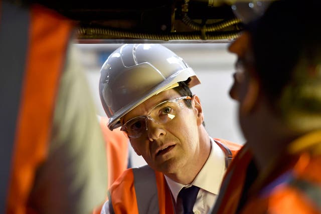 George Osborne visits a train maintenance plant in Crewe on the election campaign trail in 2015