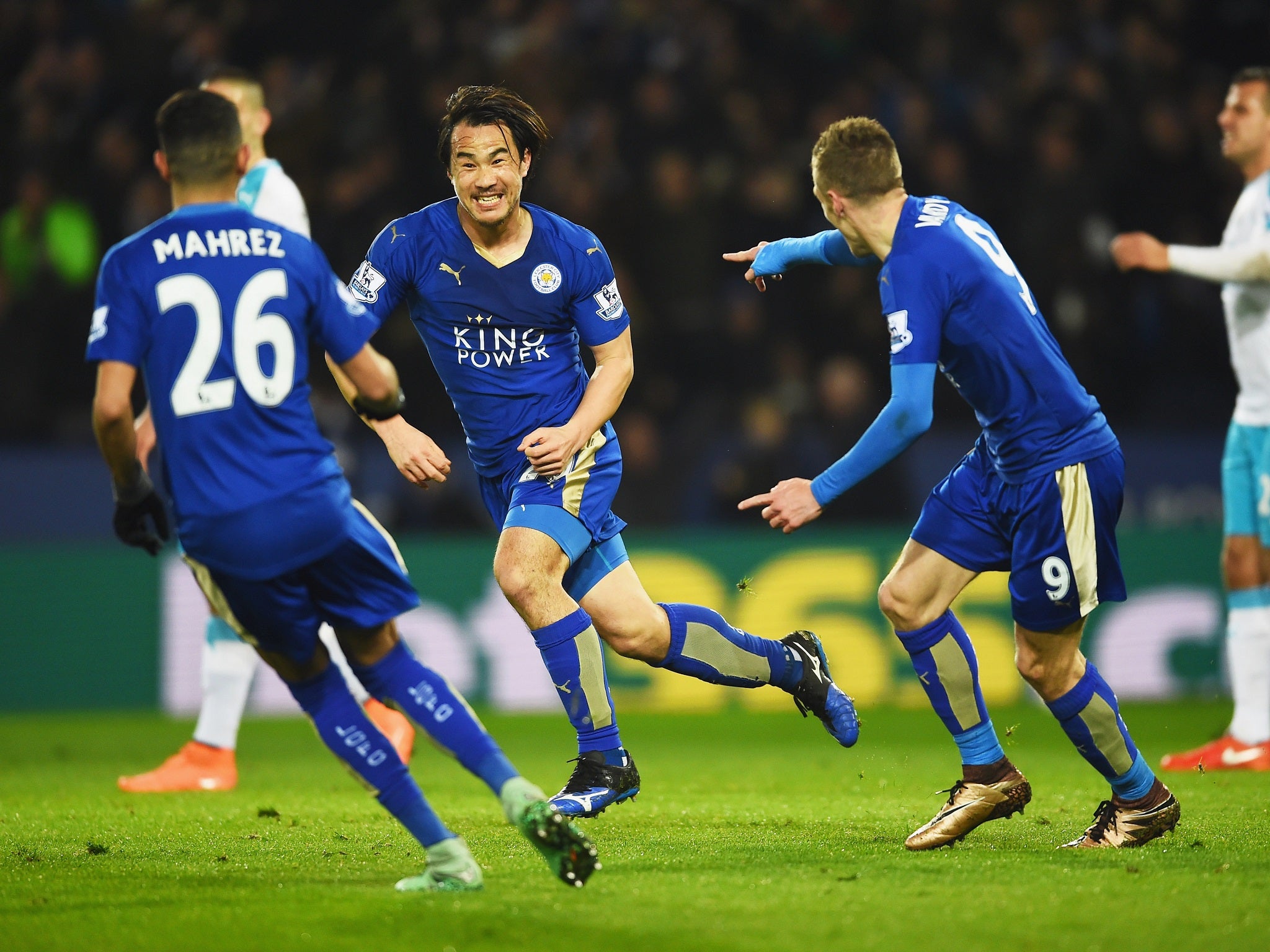 Shinji Okazaki is congratulated after giving Leicester the lead
