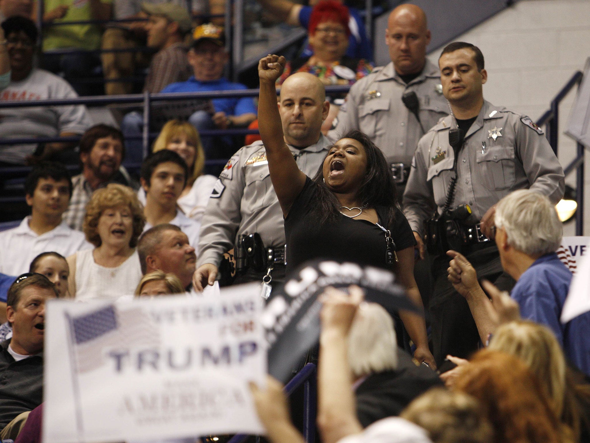 An-anti Trump protester shouts at the rally in Fayetteville