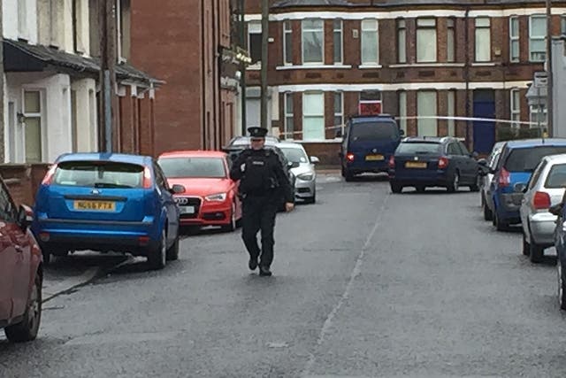Police approach the Van under which a device exploded in east Belfast.