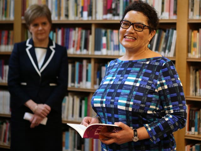 First Minister Nicola Sturgeon listens as Jackie Kay reads a poem at the Scottish Poetry Library in Edinburgh
