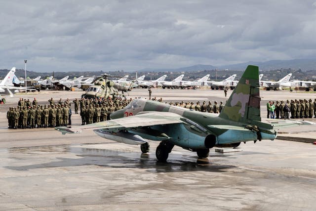 Russian troops at Hemeimeem air base in Syria on Tuesday