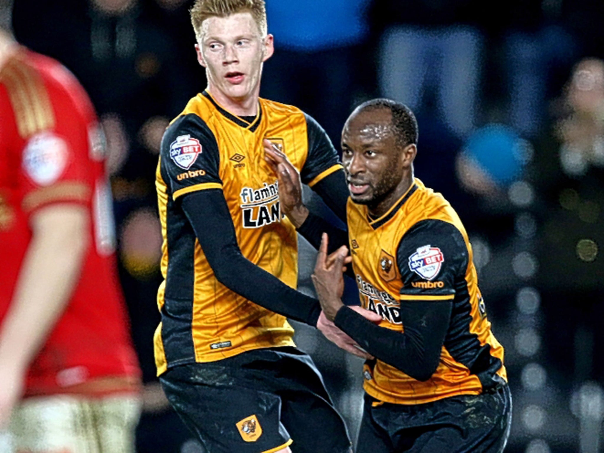 Hull’s Sone Aluko (right) celebrates his equaliser with Sam Clucas, 15 minutes after coming on at the KC Stadium