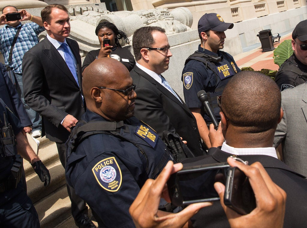 Jared Fogle (center), the former Subway spokesman, has reportedly been beaten up in prison.