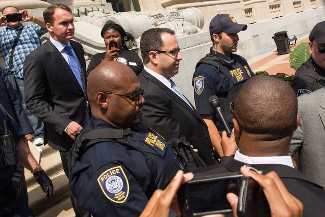 Jared Fogle (center), the former Subway spokesman, has reportedly been beaten up in prison.