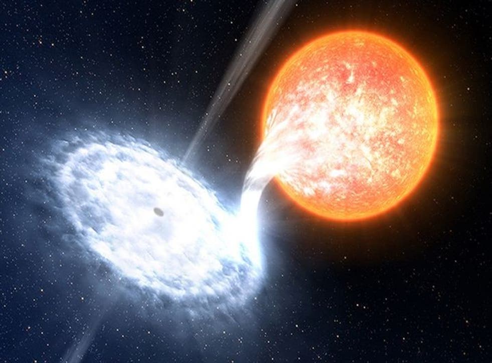 An artist's impression of a black hole devouring material from an orbiting star