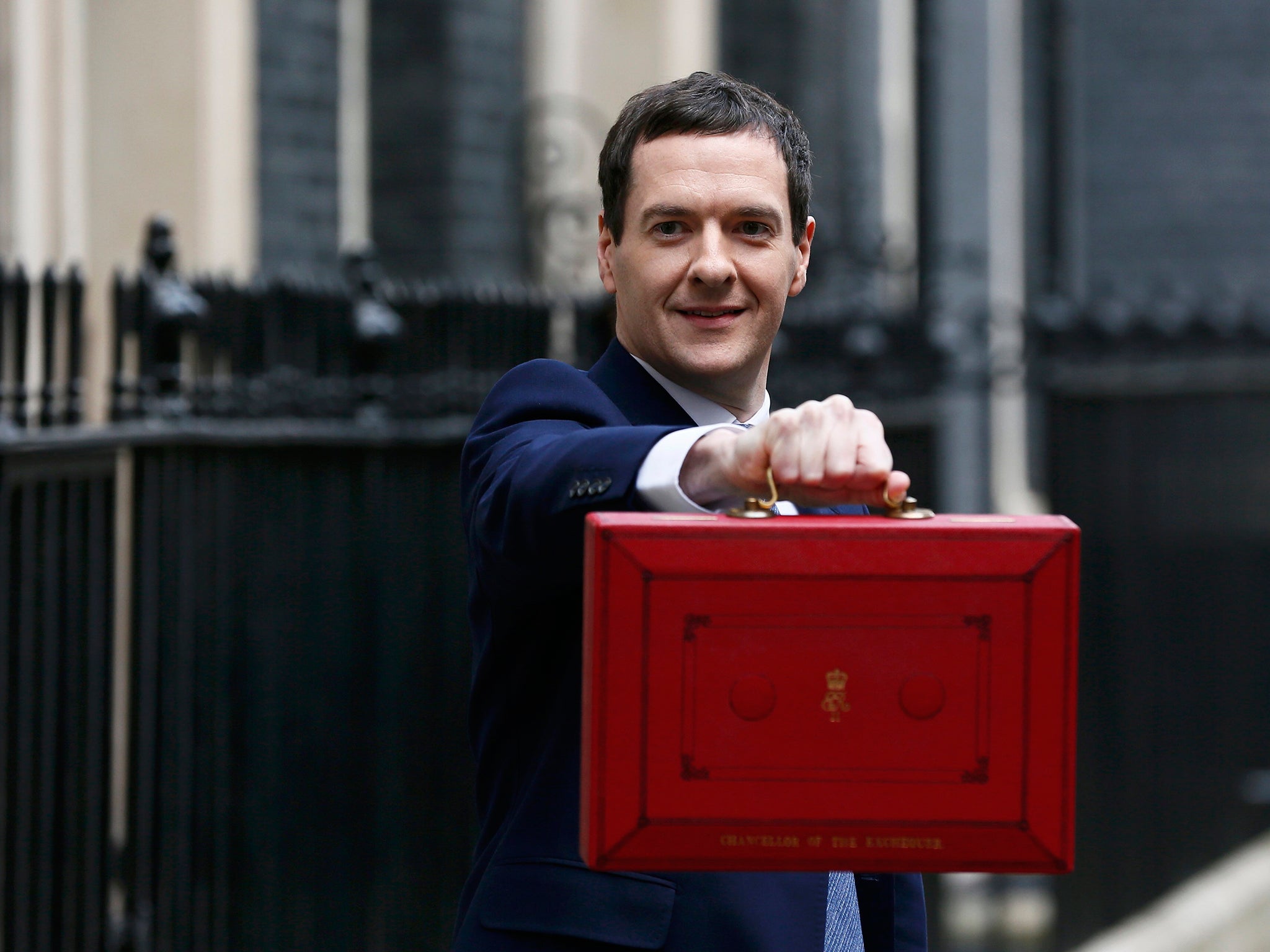Britain's Chancellor of the Exchequer, George Osborne, holds up his budget case for the cameras as he stands outside number 11 Downing Street, before delivering his budget to the House of Commons