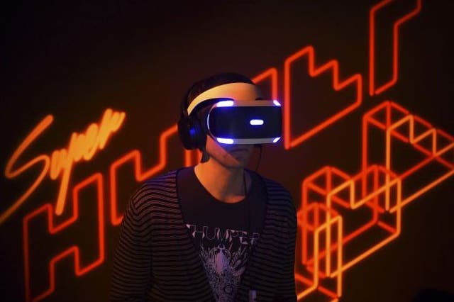 Game developer Marc Flury plays Kokoromi's Superhypercube on Sony's PlayStation VR
