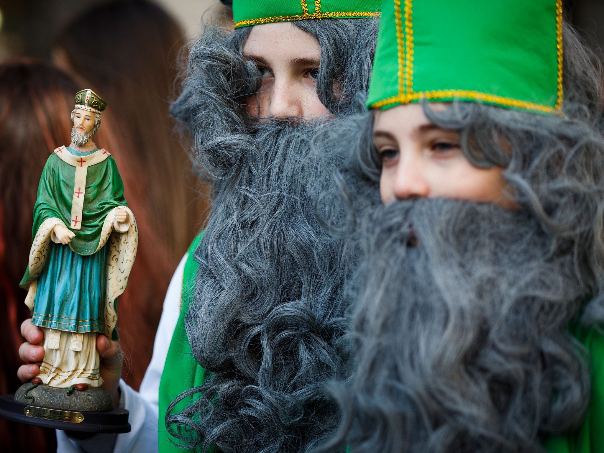 Young revellers dress up as Saint Patrick at a parade