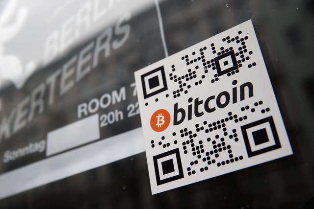 A sticker on the window of a Berlin pub indicates the acceptance of Bitcoins for payment