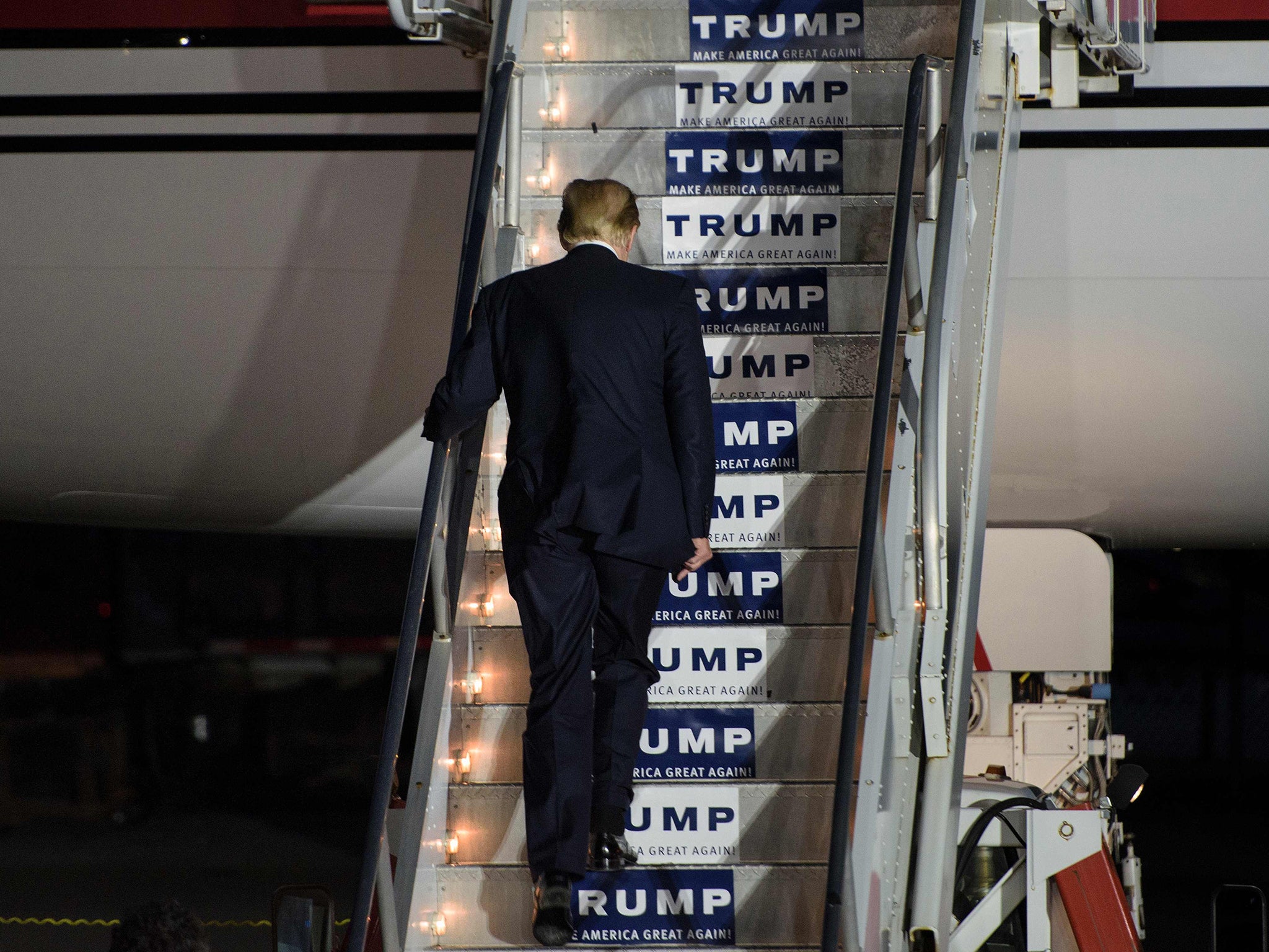 Donald Trump boards his plane following a rally in Vienna Center, Ohio.