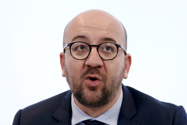 Belgian Prime Minister Charles Michel addresses a news conference in Brussels after a shootout